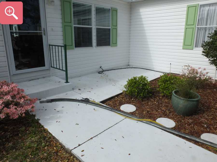 Sandblasting concrete driveway paint removal stripping